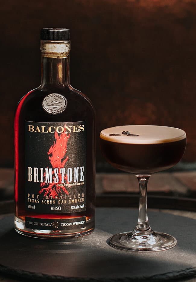 Bottle of Brimstone Smoked Whisky with Espresso Martinis on Table