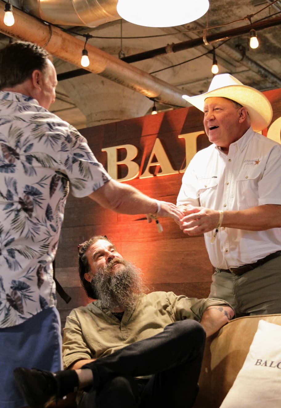 Men shaking hands and smiling