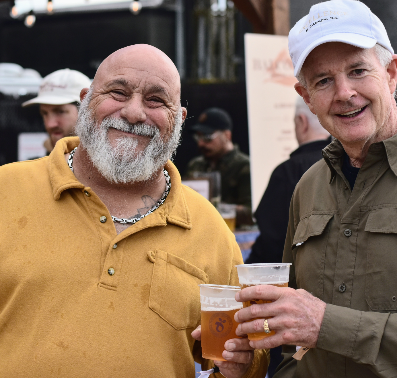Two men smiling at camera