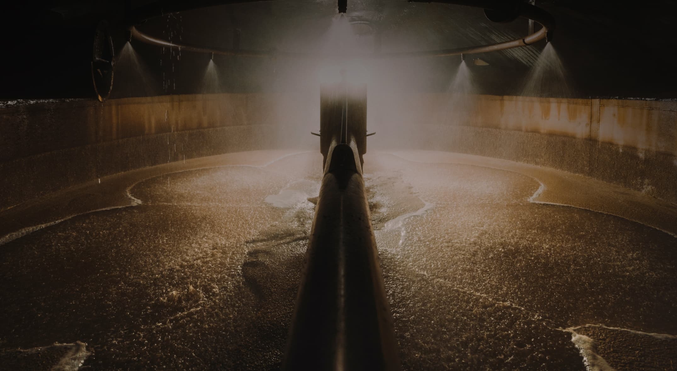machine milling barley in a vat